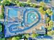 Aerial view of a winding pool with a splash pad and comfortable lounge seating at 210 Double Eagle Dr. # G1, Myrtle Beach, SC 29575