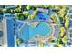 Aerial view showcasing a large outdoor pool area with abundant lounge chairs and lush surroundings at 210 Double Eagle Dr. # G1, Myrtle Beach, SC 29575