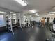 Well-equipped weight room with various machines, free weights, and mirrors at 210 Double Eagle Dr. # G1, Myrtle Beach, SC 29575