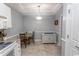 Charming breakfast nook featuring a modern chandelier, stylish flooring, and a functional storage cabinet at 2241 Waterview Dr. # 227, North Myrtle Beach, SC 29582