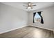A sunlit bedroom features light gray walls, wood floors, and large window at 2970 Old Bryan Dr. # A5, Myrtle Beach, SC 29577