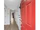 Bright entryway with a red front door, wood-look floors, and neutral paint throughout at 2970 Old Bryan Dr. # A5, Myrtle Beach, SC 29577