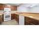 The kitchen features wood cabinets, modern appliances and wood countertops at 2970 Old Bryan Dr. # A5, Myrtle Beach, SC 29577