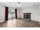 Cozy living room featuring a brick fireplace, ceiling fan, and sliding door to the patio at 2970 Old Bryan Dr. # A5, Myrtle Beach, SC 29577
