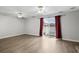 Spacious living room with sliding glass doors to the patio and modern flooring at 2970 Old Bryan Dr. # A5, Myrtle Beach, SC 29577