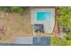 Birds-eye view of community pool and cabana, showcasing the parking lot and surrounding trees at 309 Lake Mist Ct. # 309, Longs, SC 29568