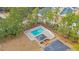 Aerial view of community pool with surrounding fence, cabana, parking and manicured landscaping at 309 Lake Mist Ct. # 309, Longs, SC 29568