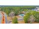 Community swimming pool and cabana nestled among mature trees in residential neighborhood at 309 Lake Mist Ct. # 309, Longs, SC 29568
