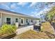 Private backyard featuring a brick patio, outdoor seating, and well-maintained landscaping at 309 Lake Mist Ct. # 309, Longs, SC 29568