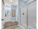 Bright bathroom with a glass-enclosed shower, dual sink vanity, and modern fixtures at 309 Lake Mist Ct. # 309, Longs, SC 29568