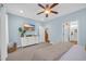 Serene bedroom featuring a dresser with a TV, a ceiling fan, and access to the ensuite bathroom at 309 Lake Mist Ct. # 309, Longs, SC 29568