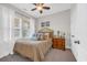 Comfortable bedroom featuring a full-sized bed with decorative pillows and a classic wooden nightstand at 309 Lake Mist Ct. # 309, Longs, SC 29568