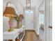 Stylish entryway featuring a decorative table, lamps, and a charming rug at 309 Lake Mist Ct. # 309, Longs, SC 29568
