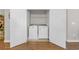 Convenient laundry closet featuring a washer and dryer unit and white bi-fold doors at 309 Lake Mist Ct. # 309, Longs, SC 29568