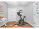Home office and exercise room featuring a stationary bike, hardwood floors, and neutral paint at 309 Lake Mist Ct. # 309, Longs, SC 29568
