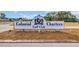 Colonial Charters Golf Club entrance sign with well-maintained landscaping at 309 Lake Mist Ct. # 309, Longs, SC 29568