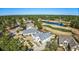 Aerial view of a home with a golf course and a pond in a residential area at 3100 Lahinch Dr., Myrtle Beach, SC 29579