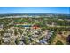Aerial view of a home in a neighborhood near a golf course surrounded by trees at 3100 Lahinch Dr., Myrtle Beach, SC 29579