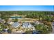 Stunning aerial view of a luxury home overlooking a lush golf course and serene lake at 3100 Lahinch Dr., Myrtle Beach, SC 29579