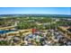 Aerial image of a white brick house with a pool and backyard, near a golf course and pond at 3100 Lahinch Dr., Myrtle Beach, SC 29579