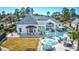 Lush backyard featuring a luxurious pool, comfortable seating, and an outdoor bar area for entertaining at 3100 Lahinch Dr., Myrtle Beach, SC 29579