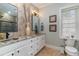 Stylish bathroom with a double vanity, granite countertop, decorative mirrors, and a neutral color scheme at 3100 Lahinch Dr., Myrtle Beach, SC 29579