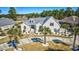 Stunning home with a well-manicured lawn, circular driveway, and lush palm trees at 3100 Lahinch Dr., Myrtle Beach, SC 29579
