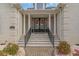 Elegant entryway with double doors, decorative wreaths, and stone steps at 3100 Lahinch Dr., Myrtle Beach, SC 29579