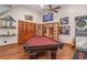 Game room with a pool table, sports memorabilia, and wooden accents at 3100 Lahinch Dr., Myrtle Beach, SC 29579