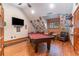 Entertainment game room featuring a pool table, mounted TV, and Jimmy Buffett-themed decor at 3100 Lahinch Dr., Myrtle Beach, SC 29579