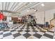 Spacious garage with checkerboard floors, ample storage, and overhead lighting at 3100 Lahinch Dr., Myrtle Beach, SC 29579