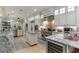 Modern kitchen boasts stainless appliances, stone backsplash, and custom cabinetry at 3100 Lahinch Dr., Myrtle Beach, SC 29579