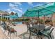 Relaxing patio area featuring outdoor dining, lounge seating, and a view of the pool at 3100 Lahinch Dr., Myrtle Beach, SC 29579