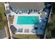 Aerial view of a private backyard swimming pool, surrounded by lounge chairs and a privacy fence at 321 Jay St., Murrells Inlet, SC 29576