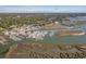 Aerial view of a coastal community with a marina, waterfront restaurants, and boats docked in the harbor at 321 Jay St., Murrells Inlet, SC 29576