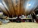 Spacious attic featuring ample storage with plywood flooring and a sturdy wooden beam ceiling at 321 Jay St., Murrells Inlet, SC 29576
