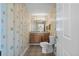 Half bath featuring seashell wallpaper and tiled floors at 321 Jay St., Murrells Inlet, SC 29576