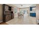 Inviting dining area featuring an elegant wooden hutch and a dining table under a modern ceiling fan at 321 Jay St., Murrells Inlet, SC 29576