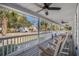Relaxing front porch with multiple rocking chairs overlooking the lush greenery at 321 Jay St., Murrells Inlet, SC 29576