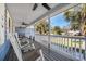 Inviting front porch with ceiling fans and rocking chairs, perfect for relaxing and enjoying the outdoors at 321 Jay St., Murrells Inlet, SC 29576
