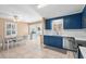 Open-concept kitchen area with blue cabinets and a view of the dining room at 321 Jay St., Murrells Inlet, SC 29576