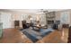 Well-lit living room with hardwood floors, a stone fireplace, and ample seating space at 321 Jay St., Murrells Inlet, SC 29576