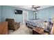A nicely appointed main bedroom featuring a ceiling fan and a TV is ready for new occupants at 321 Jay St., Murrells Inlet, SC 29576