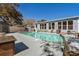 Backyard pool and patio area with a sun deck, outdoor seating, and privacy fencing at 321 Jay St., Murrells Inlet, SC 29576