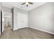 Bedroom with a ceiling fan, hardwood floors, and closet, offering ample space and storage at 351 Lakota Loop, Longs, SC 29568