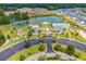 Aerial view of community amenities, including a pool, playground, and pristine lake at 3600 White Wing Circle, Myrtle Beach, SC 29579