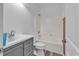 Clean bathroom with a modern gray vanity, integrated sink, and a bathtub-shower combination at 3600 White Wing Circle, Myrtle Beach, SC 29579