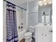 Bathroom featuring a shower/tub combo with a blue striped curtain, toilet, and a vanity with mirror at 3600 White Wing Circle, Myrtle Beach, SC 29579