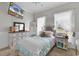 Cozy bedroom with carpeted floors, white furniture, a television, and sheer curtains for natural light at 3600 White Wing Circle, Myrtle Beach, SC 29579