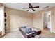 Bedroom with carpet, ceiling fan, neutral walls, and view into bathroom at 3600 White Wing Circle, Myrtle Beach, SC 29579